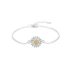 Silver necklace with a daisy flower pendant on a white surface