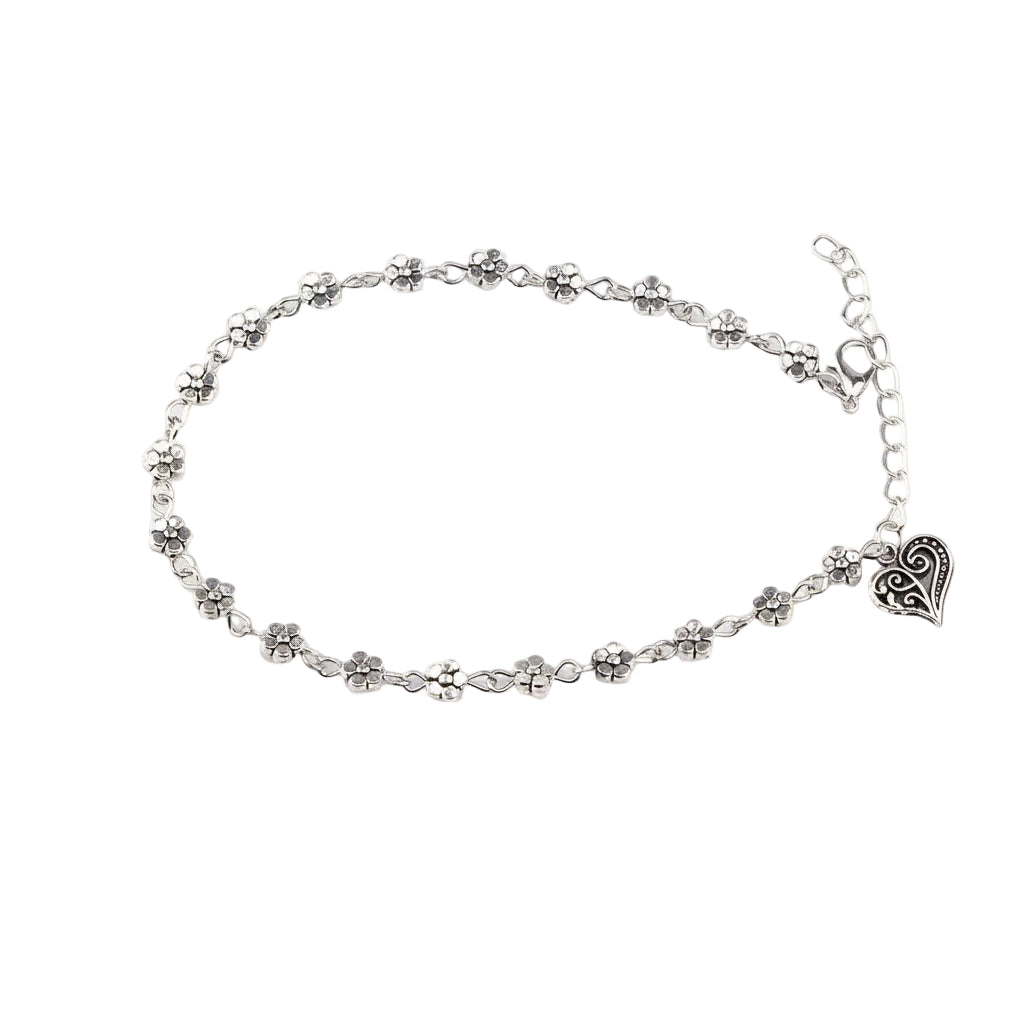 Silver anklet with heart charm on a white background