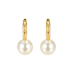 Gold hoop earrings with pearl beads on a white background