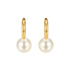 Gold hoop earrings with pearl beads on a white background